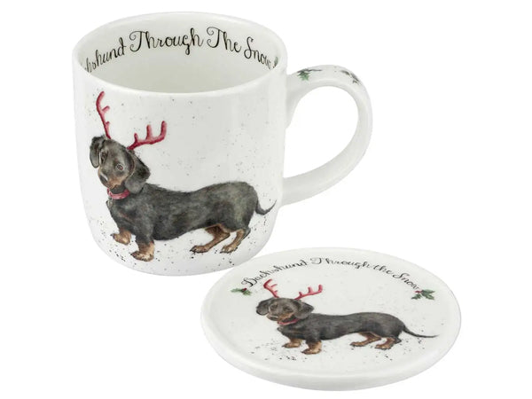 Mug and coaster set with dachshund design and text 'Duchshund  Through The Snow' on a white background
