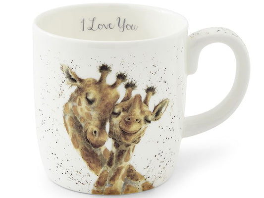 A white ceramic mug with a speckled finish, featuring a watercolor illustration of two giraffes hugging on the front. The inside of the mug is printed with the words 'I Love You' in a cursive font.