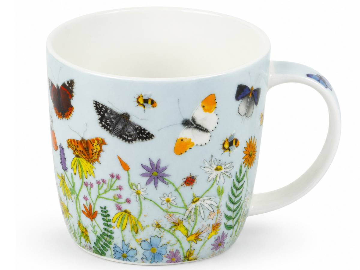 A white ceramic mug featuring a detailed illustration of various butterflies and wildflowers on a pale blue background, set against a plain white studio backdrop.