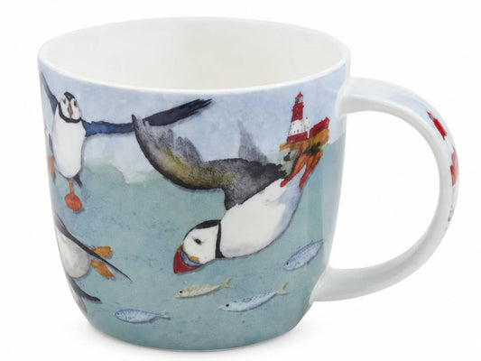 A white ceramic mug featuring a whimsical illustration of puffins and fish on a light blue watercolor-style background.