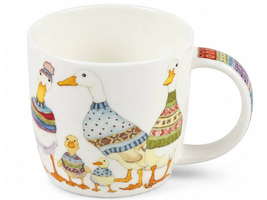 A white ceramic mug featuring a whimsical illustration of a family of ducks wearing colorful knit sweaters, with a matching patterned handle.