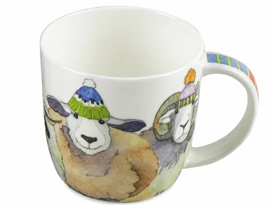 A white ceramic mug featuring a watercolor illustration of sheep wearing colorful knit hats, with a striped handle.