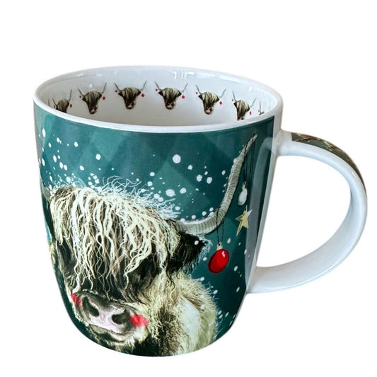 Mug with a highland cow design on a teal background