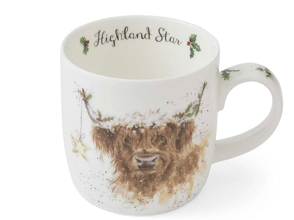 A white ceramic mug featuring a watercolor illustration of a Highland cow wearing a holly wreath, with the text 'Highland Star' printed inside the rim.