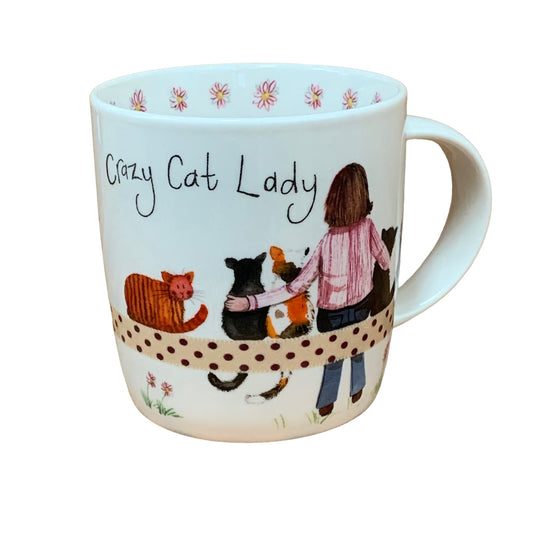 This Alex Clark mug features an illustration of a lady with her beloved cats, making it ideal for coffee, tea, and other hot drinks. Additionally, the mug boasts illustrations around the inside rim and down the handle, adding to its delightful appeal.