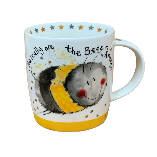 This Alex Clark mug features a delightful illustration of a joyful bee alongside the words "you really are the bees knees." It's perfect for enjoying coffee, tea, and other hot drinks. Additionally, the mug includes illustrations around the inside rim and down the handle, enhancing its charm and appeal.