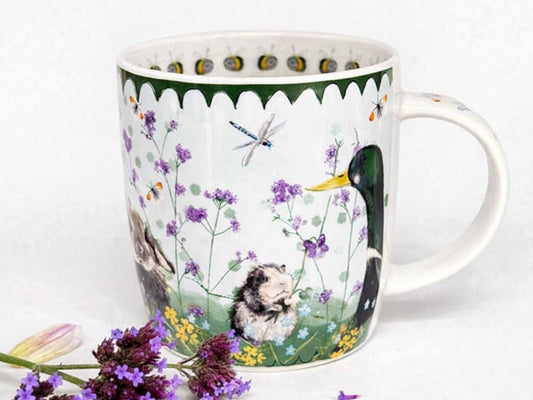 Alex Clark Bramble mug with woodland animals, dragonflies and purple flowers on a pale green background