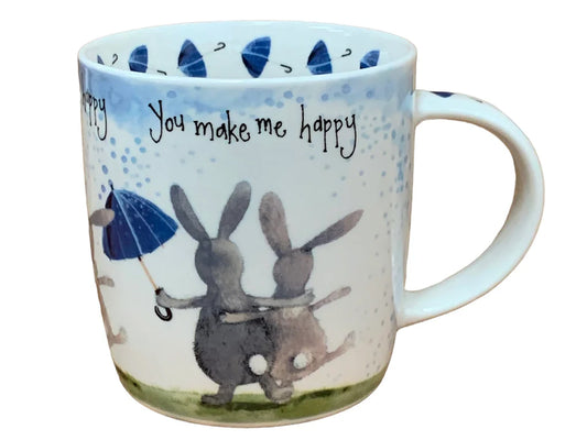 This Alex Clark mug showcases two delightful and cheerful bunny rabbits alongside the words "you make me happy" along the top of the mug. Additionally, the mug features a charming umbrella illustration around the inside rim and illustrations down the handle, adding to its whimsical appeal.