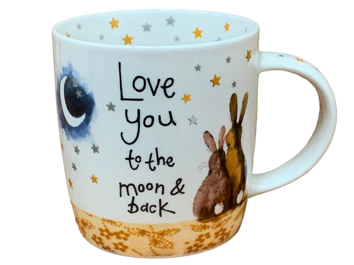 This Alex Clark mug features two lovely bunnies gazing at the night sky, accompanied by the endearing phrase "Love you to the moon & back." Additionally, the mug includes star illustrations around the inside rim and down the handle, adding to its enchanting appeal.