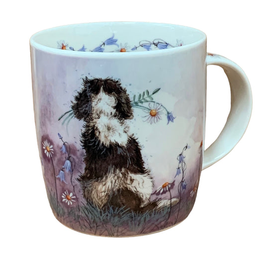 This Alex Clark mug showcases a delightful Spaniel dog admiring the view while holding a flower in its mouth.