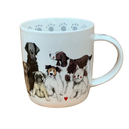 The Alex Clark mug showcases a group of assorted dog breeds in its illustration. Additionally, the mug features dog paw illustrations around the inside rim and down the handle, adding to its charm. Moreover, within the same illustration, there is a matching teapot and teabag tidy, completing the delightful set.