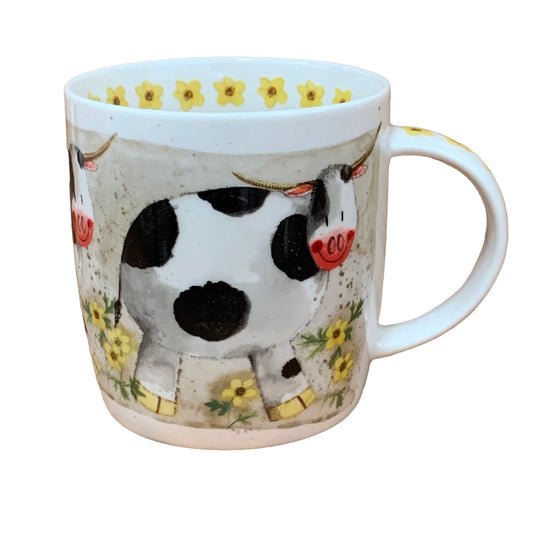 This Alex Clark mug depicts a cow named Dorothy standing in her meadow of flowers. Adding to its appeal, the mug features yellow flower illustrations around the inside rim and down the handle. Additionally, there is a matching teapot and teabag tidy in a similar illustration, completing the charming set.