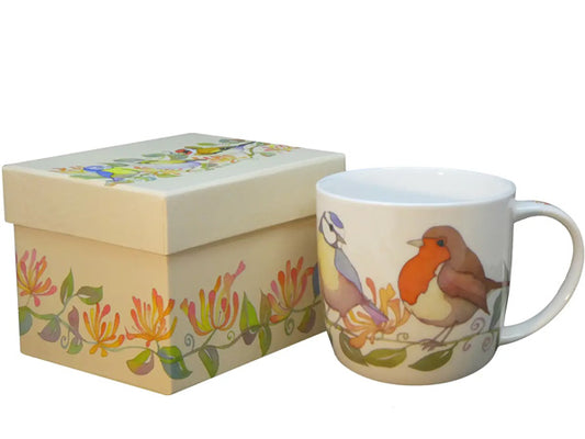 The "Garden Birds" Bone China Mug, a beautiful creation by Emma Ball, is carefully presented in an enchanting gift box, making it perfect for gifting or as a delightful personal indulgence.