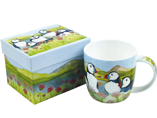 Crafted by Emma as part of her Puffins Collection, these exceptional Fine Bone China mugs are elegantly housed in a striking gift box, making them an impeccable choice for gifting to a special recipient.