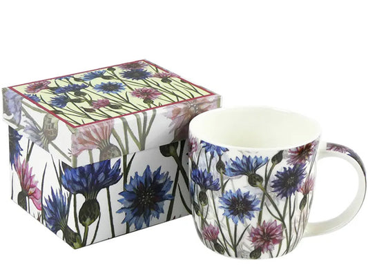 Designed by Caroline Cleave, this Fine Bone China mug adorned with Cornflowers is tastefully showcased in a captivating gift box, making it the ideal gift for a special someone.