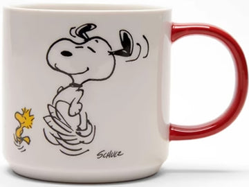 Embrace the rhythm with this enchanting Magpie x Peanuts mug, featuring the iconic pair Snoopy and Woodstock caught up in a lively dance. Ideal for those who savor a delightful brew and a spontaneous dance, this mug serves as a charming gift. Turn it around, and you'll discover the empowering phrase in black writing: 'To Dance is to Live.'