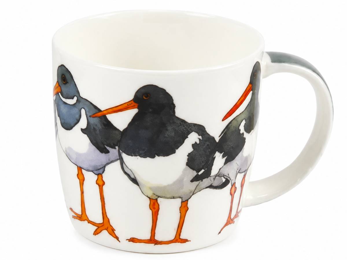 A white ceramic mug featuring a painted illustration of three oystercatchers with black, white, gray, and orange details, set against a plain white background.