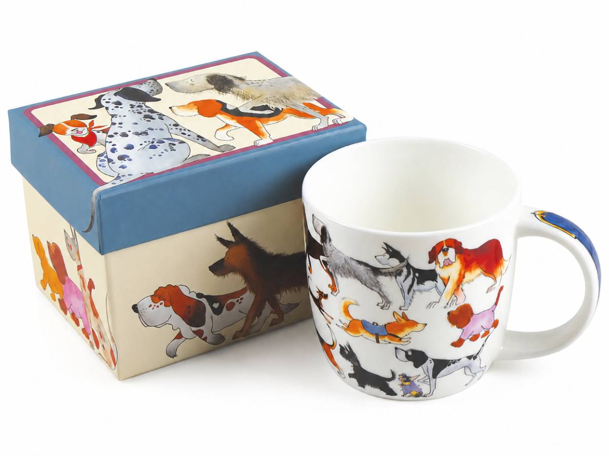 A white ceramic mug and its matching gift box, both decorated with a colorful illustration of various dog breeds. The box features a blue lid and a cream-colored base, while the mug has a white base with a multicolor dog print and a blue handle accent.