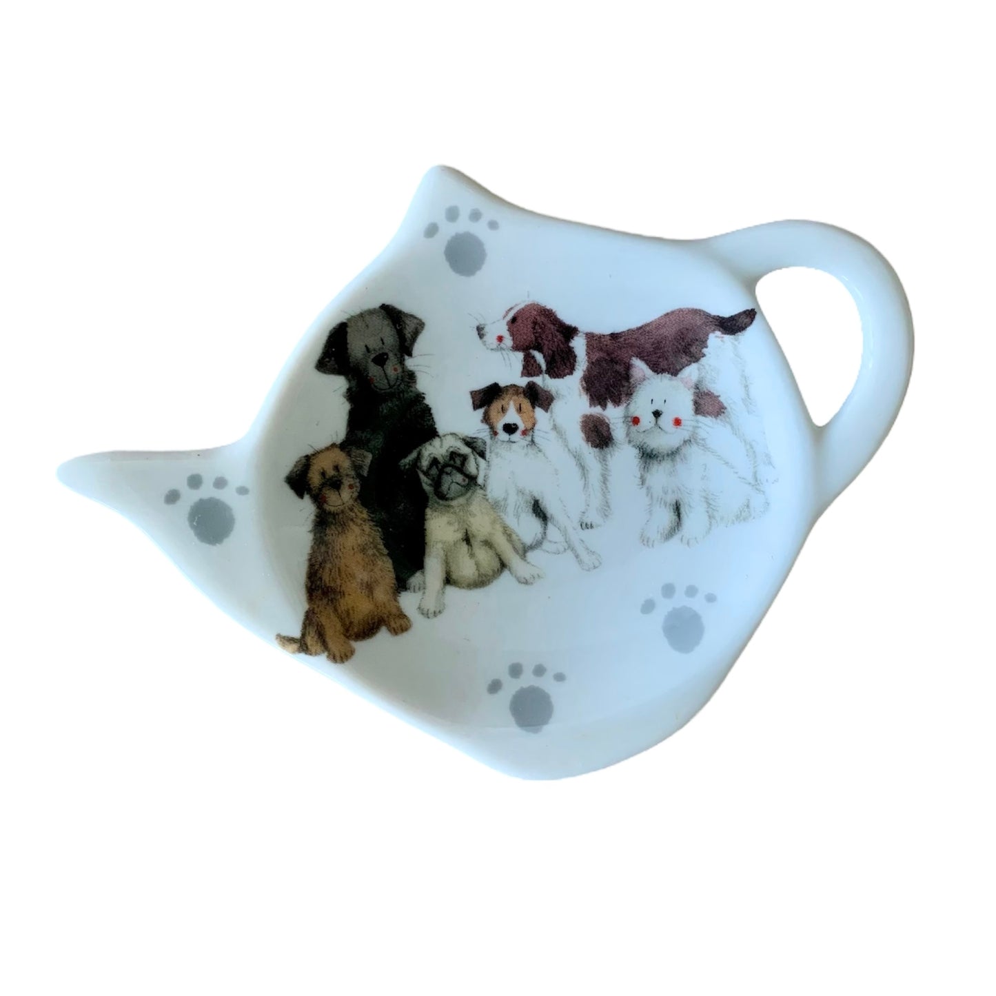 This Alex Clark teabag holder showcases a charming array of diverse dog breeds in its illustration. Complementing the design are matching teapot and mugs adorned with the same delightful imagery.