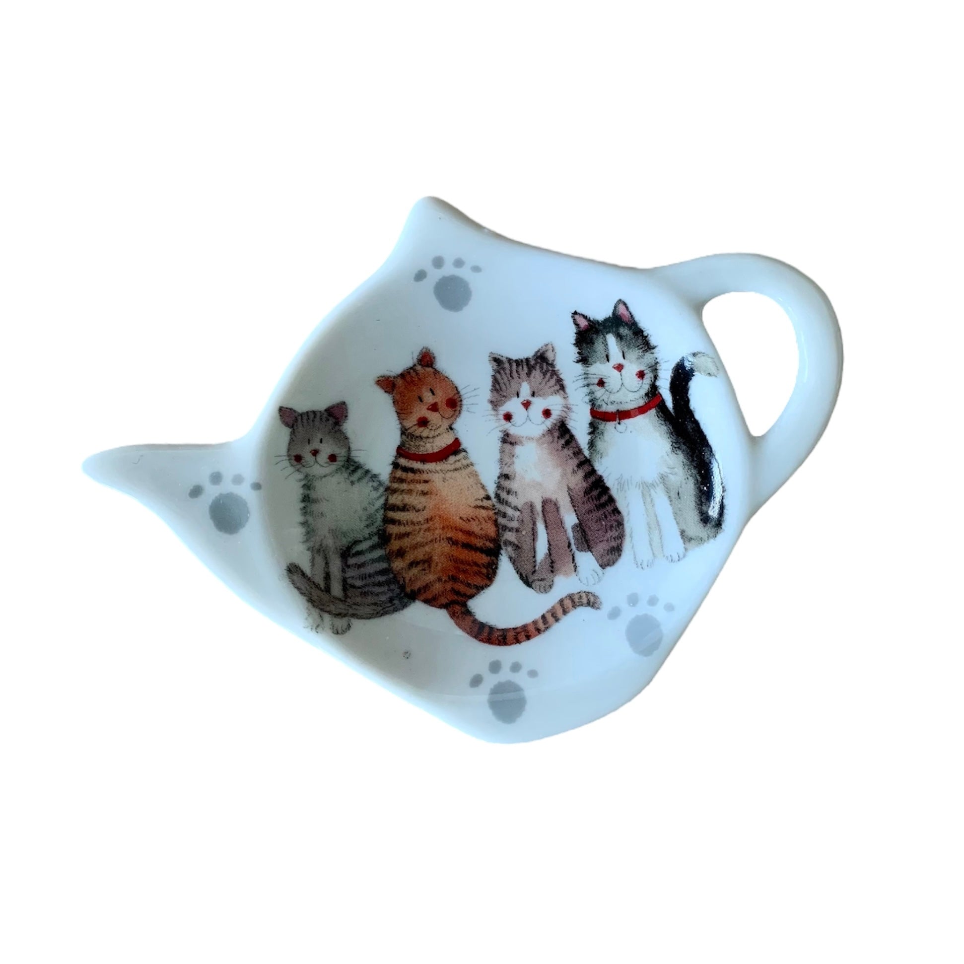 The Alex Clark teabag holder features an illustration of a delightful assortment of cheerful cat breeds. Additionally, the same charming imagery adorns matching teapot and mugs within the illustration.