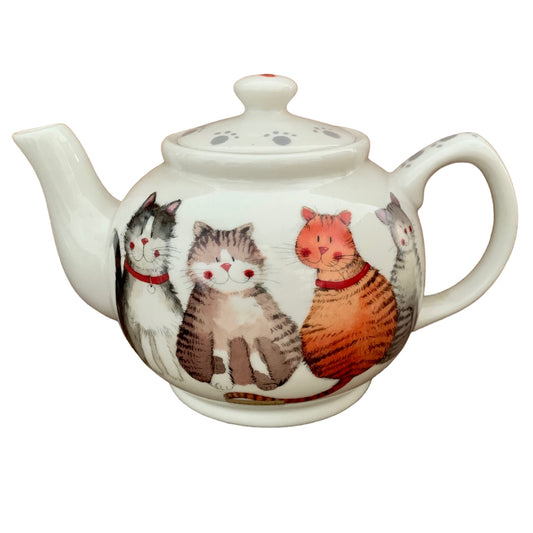 The Alex Clark teapot radiates adorableness with its illustration of a delightful array of joyful cats. Alongside, within the same illustration, there's a matching tea bag tidy and mugs adorned with the same cheerful imagery.