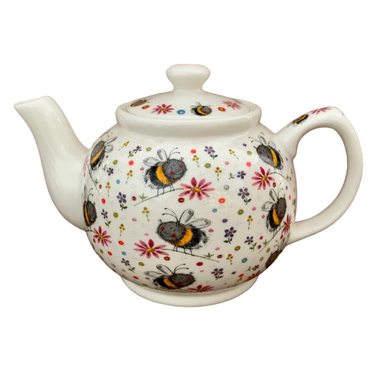 The Alex Clark teapot charms with its adorable illustration of bumblebees flying around a meadow of flowers. Accompanying the teapot are a matching tea bag tidy and mugs, all adorned with the delightful imagery from the same scene.