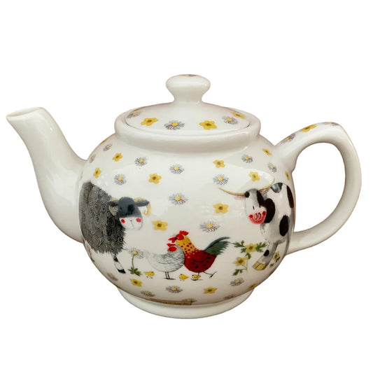 The Alex Clark teapot showcases an assortment of endearing farm animals in its illustration. Additionally, within the same artwork, there's a matching tea bag tidy and mugs adorned with the charming imagery of the farm animals.