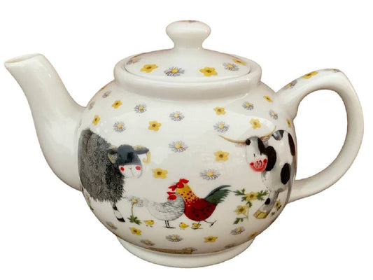 A white ceramic teapot decorated with a colorful farm animal and flower pattern, featuring a black sheep, red rooster, cow, and daisies.