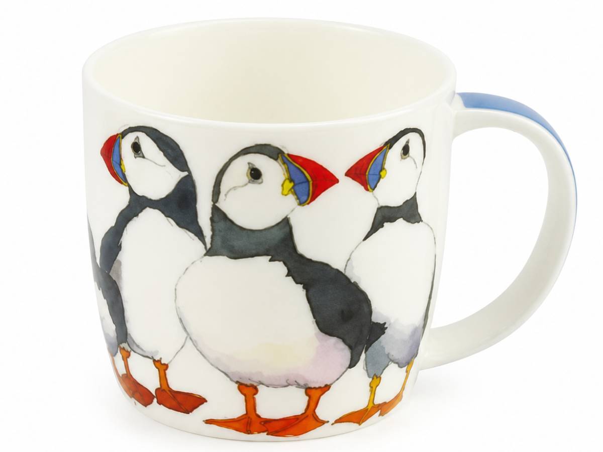 A white ceramic mug featuring a painted illustration of three puffins with colorful beaks and orange feet, set against a plain white background.