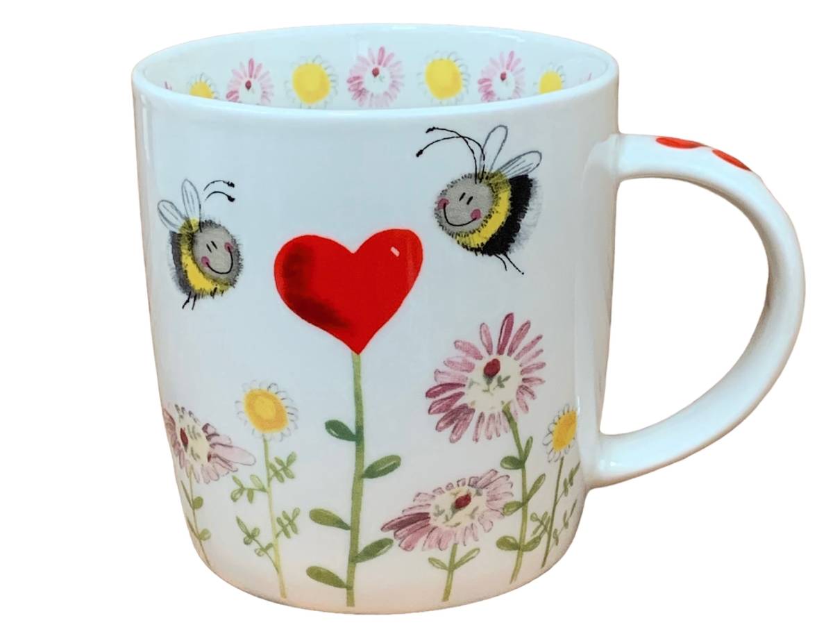The Alex Clark mug depicts two lovely bees hovering over a heart flower. Complementing its design, the mug includes flower illustrations around the inside rim and down the handle.