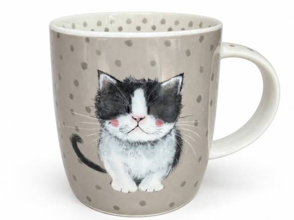 A ceramic mug with a gray and white polka dot pattern, featuring a detailed illustration of a black and white kitten on the front, set against a plain white background.