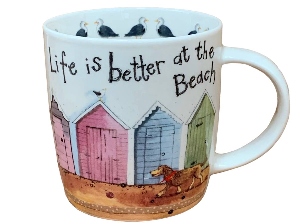 This Alex Clark mug features an adorable illustration of a dog strolling past brightly colored beach huts, accompanied by the uplifting phrase "Life is better at the beach." It's an ideal choice for enjoying coffee, tea, and other hot beverages. Additionally, the mug includes illustrations around the inside rim and down the handle, adding to its delightful appeal.