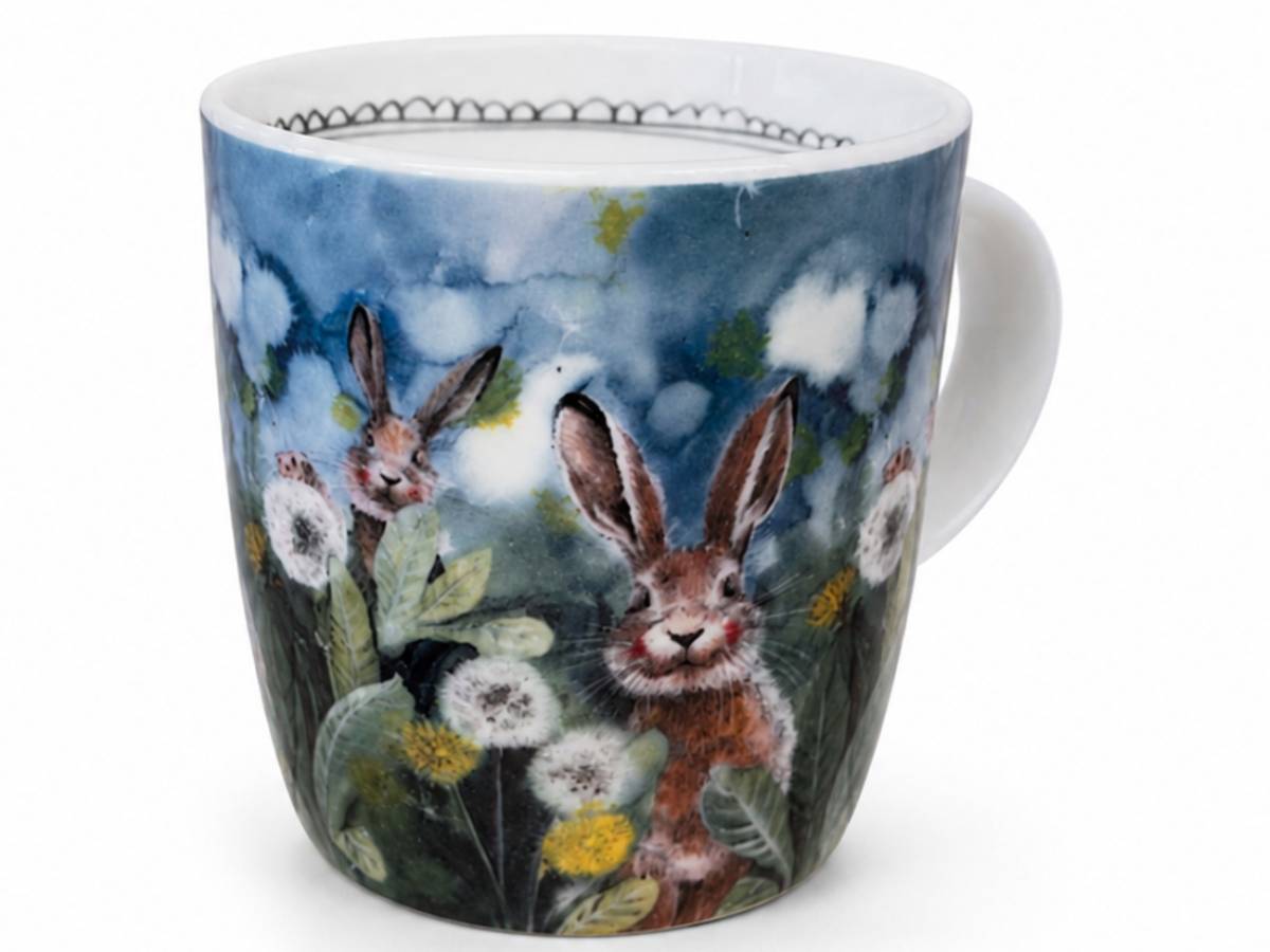 Little Rabbits Mug in vegan china, decorated with bunnies and wildflowers beneath a deep blue sky. A cute gift for rabbit and nature lovers.