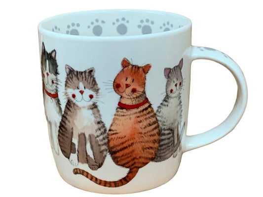 This Alex Clark mug showcases a beautiful array of different happy and content cats in its illustration. Additionally, the mug features cat paw illustrations around the inside rim and down the handle, adding to its charm. Moreover, within the same illustration, there is a matching teapot and teabag tidy, completing the delightful set.
