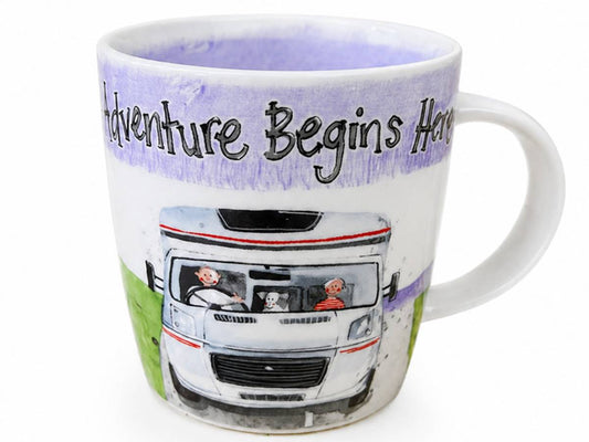 A white ceramic mug featuring a hand-painted illustration of a motorhome with people and a dog inside, under a purple watercolor-textured band with the text 'Adventure Begins Here'.