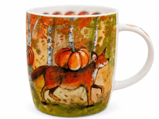 A white ceramic mug featuring a painted autumn scene with a fox carrying pumpkins among birch trees in orange, green, and brown tones.
