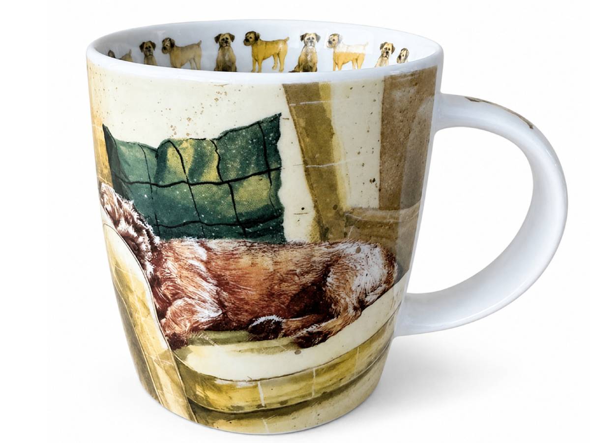 A white ceramic mug featuring a detailed illustration of a sleeping dog on a cushion, with a row of small dog portraits printed around the inner rim.