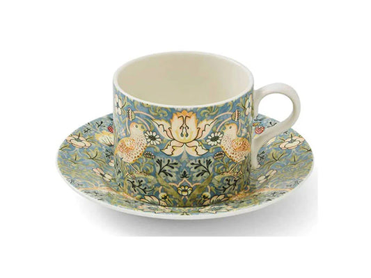 As picturesque as can be, this teacup and saucer set from Morris &amp; Co. showcases the iconic Strawberry Thief design, featuring graceful birds amid luscious strawberries and vibrant blooms. Designed for versatility, you can effortlessly mix and match this set with other motifs from the Morris &amp; Co. collection to curate a stunning ensemble bursting with rich colours.