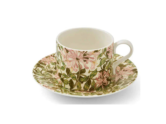 Enhance your afternoon tea experience with our enchanting Morris &amp; Co. Honeysuckle Teacup and Saucer. Designed by May Morris in 1883, the Honeysuckle pattern remains a beloved classic in households worldwide. Adorned with delicate flowers and intertwining leaves, this exquisite design brings a breath of nature into your home. Indulge in the timeless elegance of Morris &amp; Co.