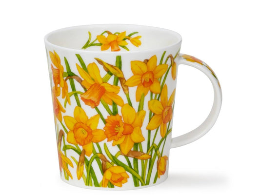 A white ceramic mug decorated with a vibrant yellow and orange daffodil pattern, set against a plain white background.