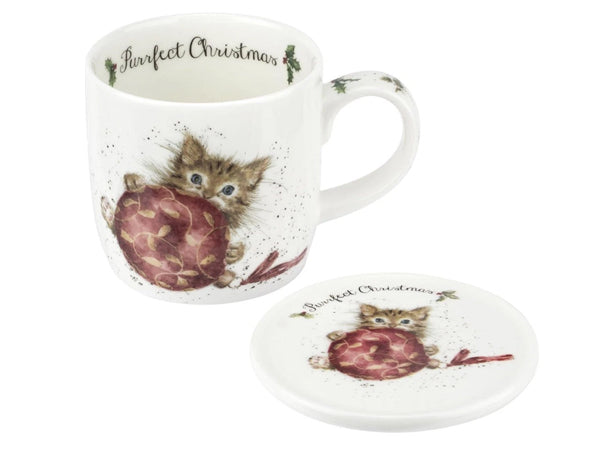 white mug and coaster with kitten and bauble illustration