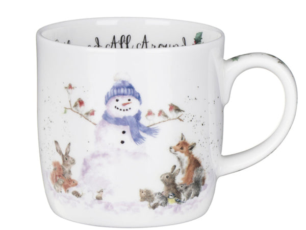 A white ceramic mug featuring a whimsical winter illustration of a snowman wearing a blue hat and scarf, surrounded by rabbits, a fox, birds, and snowflakes. The mug is shown against a plain white background.