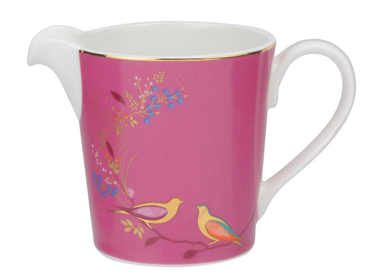 Enhance your tea service with the vibrant porcelain cream jug from the Sara Miller London Chelsea range. Featuring a captivating fuchsia pink background adorned with intricate gold detailing and charming lovebirds, this jug seamlessly combines style with practicality