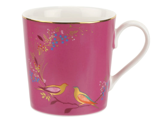 Presenting the Pink Sara Miller London Chelsea Mug, showcasing one of the collection's most iconic designs. This porcelain mug boasts a contemporary interpretation of tropical prints, featuring birds and foliage against a vibrant fuchsia backdrop.